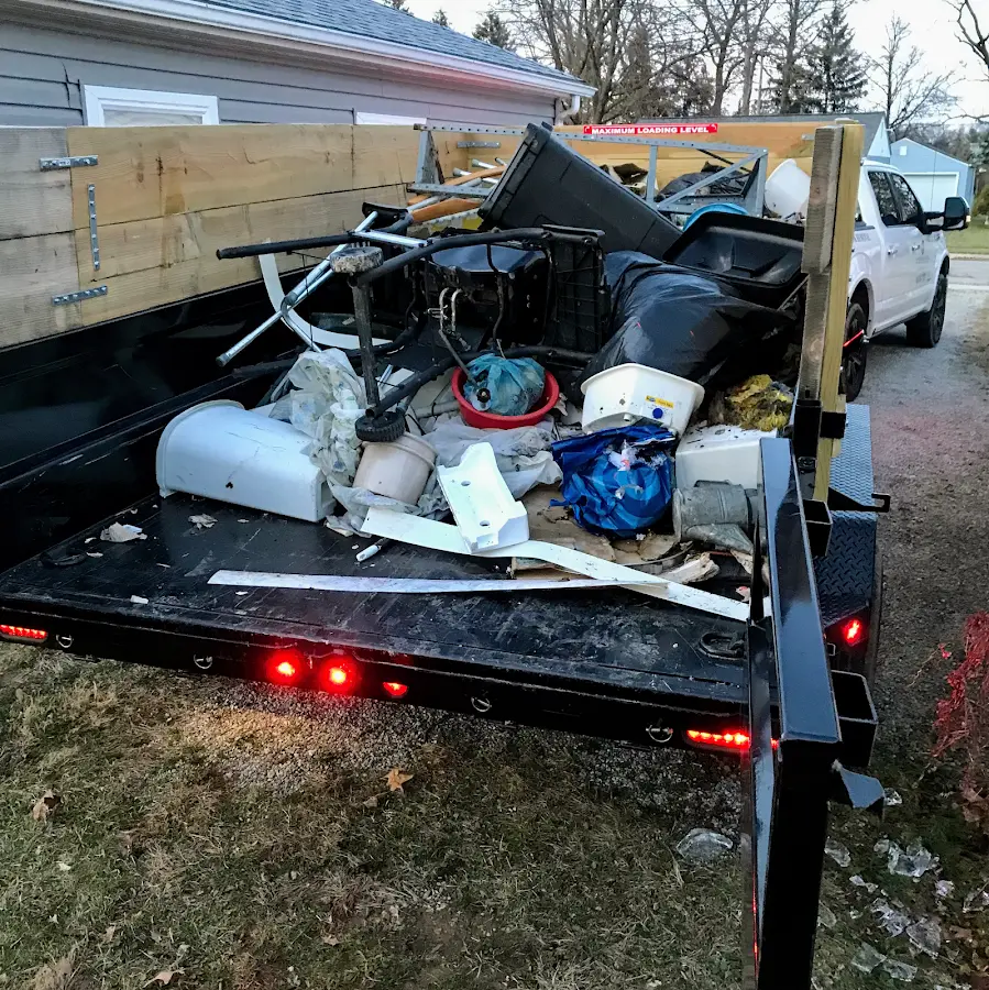 Roll-off dumpster delivered to a residential driveway in St. James