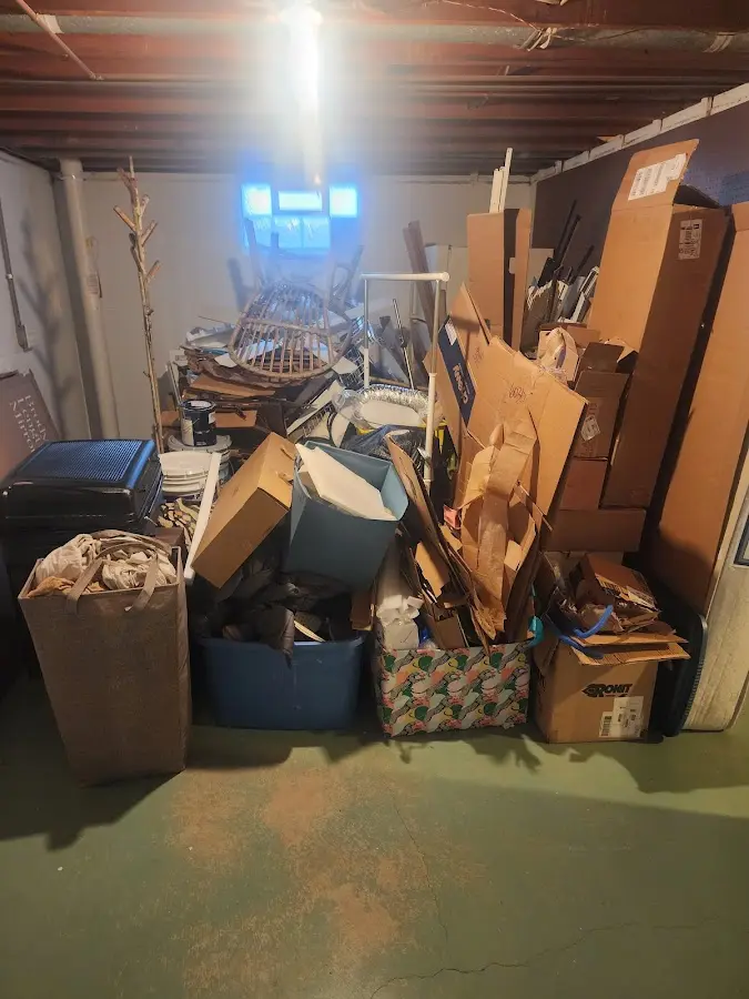 Roll-off dumpster container at job site for 2 Yard Dumpster Rental in St. James